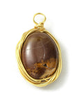 Mokiite pendant wrapped in golden copper wire - Stability, rooting and mental clarity