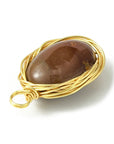 Mokiite pendant wrapped in golden copper wire - Stability, rooting and mental clarity