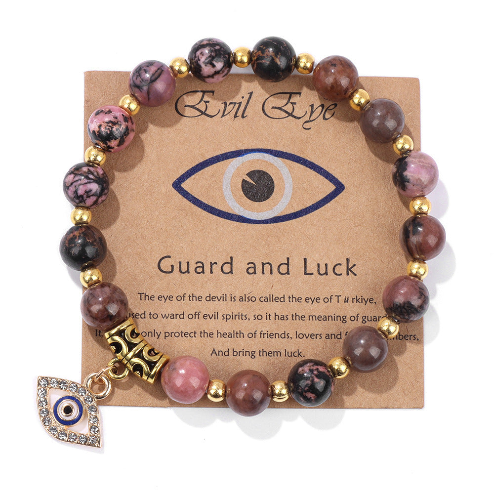 Bracciale in Rodonite Naturale con Charm Occhio Di nazar in Zirconi – Elastico